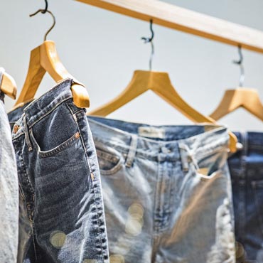 Jeans hanging in a clothing store display