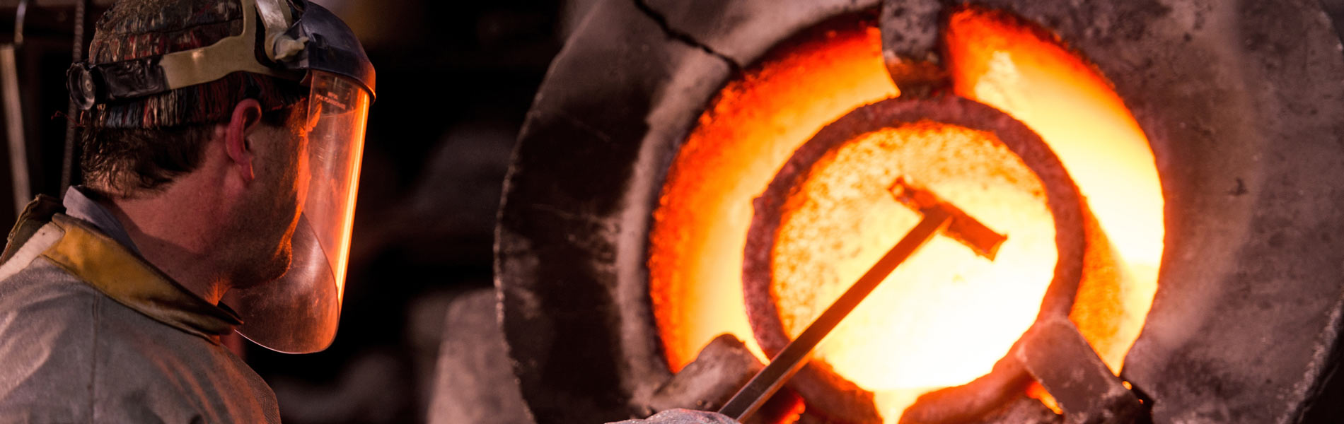 Man working in an industrial forge