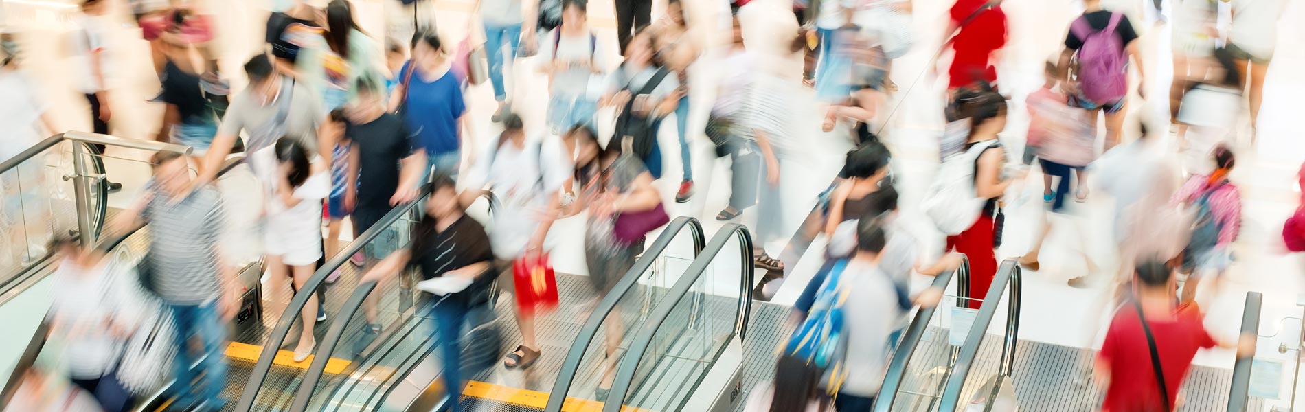 Shoppers on an escalator