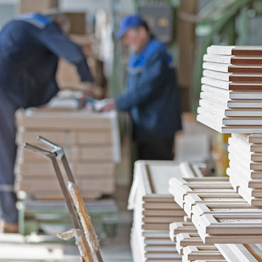 Workers in a sauna product factory