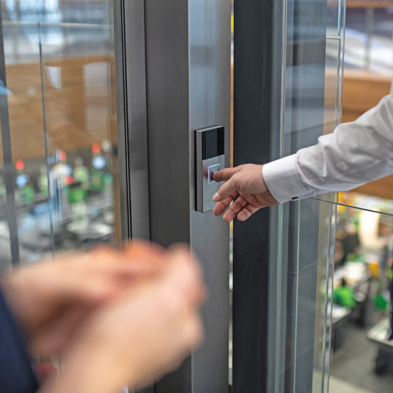 Man pressing elevator button