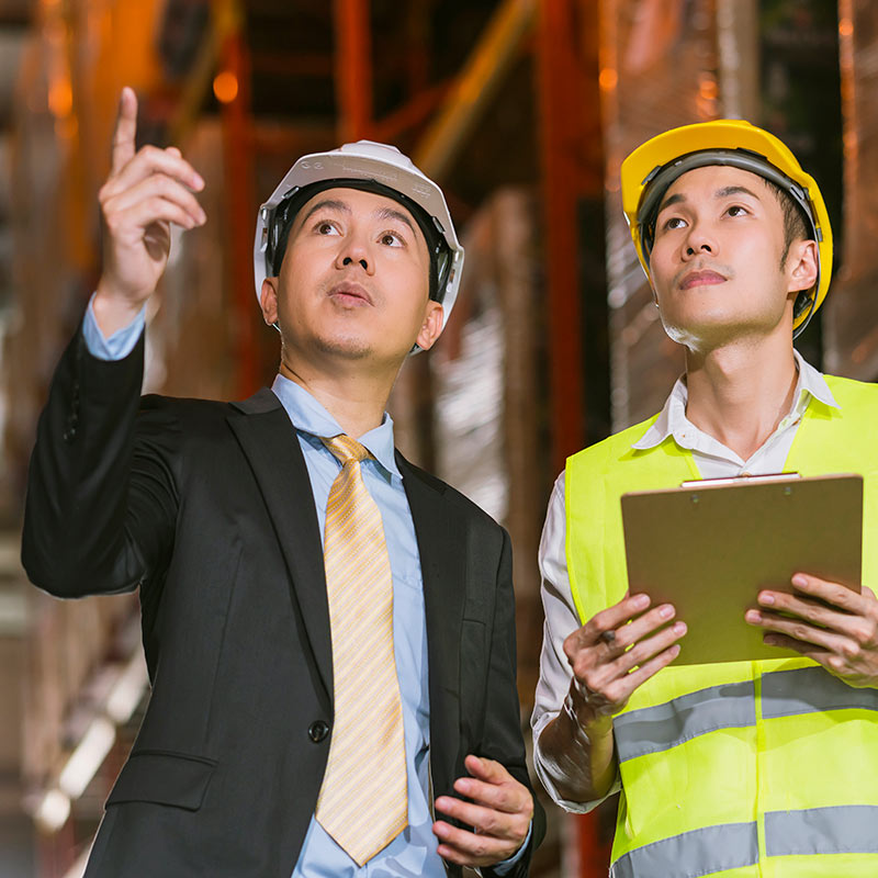 Men in discussion during a factory inspection