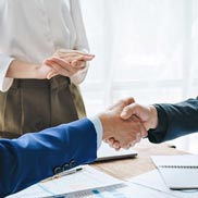 Asian business people shake hands