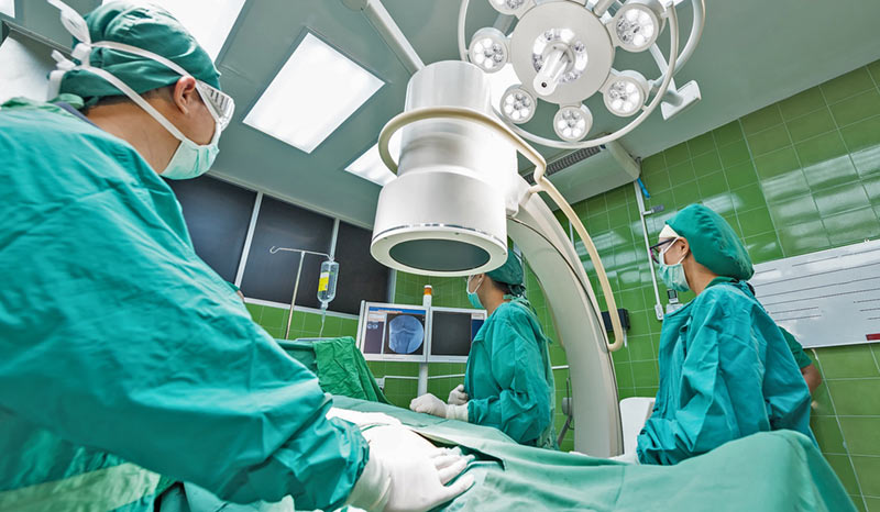 Surgeons in a hospital operating theatre