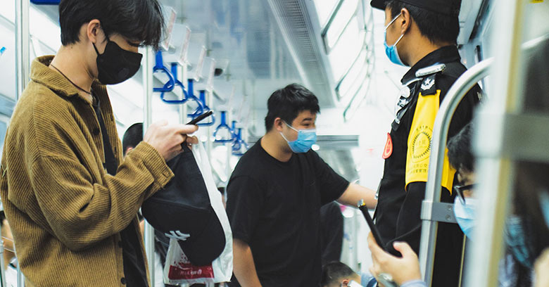 People using mobile phones on Shenzhen metro