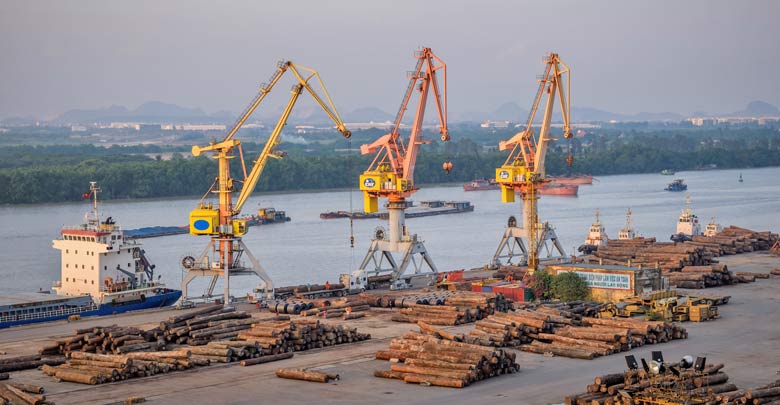 Loading wood at a Vietnamese cargo port