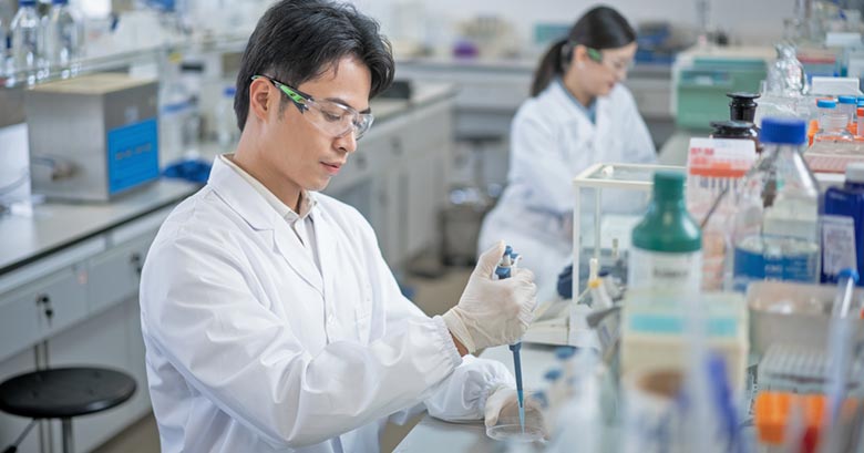 Workers in a biotech lab